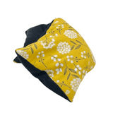 whiffy 6" x 12" microwavable heating pad hot and cold pack in mustard floral fabric with black flannel on the other side