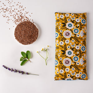 Whiffy Bean Bag, a microwavable heating pad/ice pack in size large, 12" x 6" in a mustard floral flannel fabric.